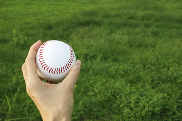 Hand holding the ball