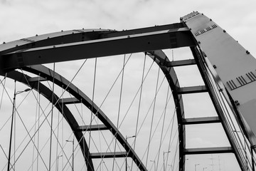 Steel construction of the red bridge. Black and white
