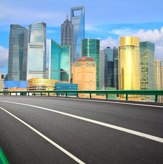 Fototapeta na wymiar Empty road with Shanghai Lujiazui city buildings
