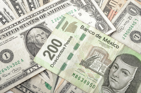 Dollar and Mexican Peso Bills