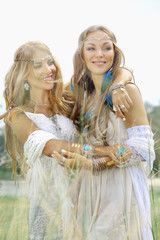 Fototapeta na wymiar two happy hippie girls