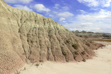 Badlands landscape, formed by deposition and erosion by wind and water, contains some of the richest fossil beds in the world, Badlands National Park, South Dakota, USA - obrazy, fototapety, plakaty