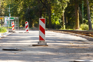 Road sign on city street informing about danger