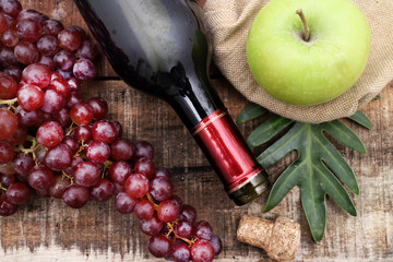 Red wine and grapes in vintage setting