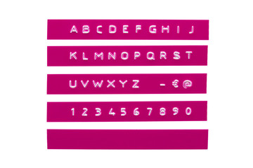 Embossed alphabet on purple plastic tape