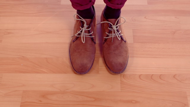 Hipster man shoes on wooden floor