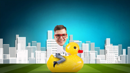 Businessman on rubber duck