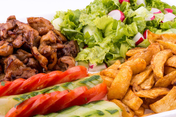 fried chicken with salad and potatoes - close up