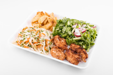 fried chicken with salad and potatoes