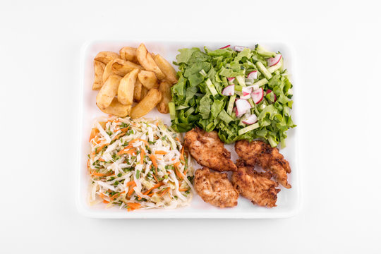 fried chicken with salad and potatoes