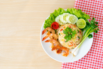 Top view ; Shrimp fried rice on wooden background