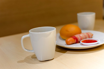 Coffee, bread and sausage