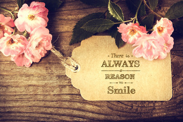 There is always a reason to smile message with roses