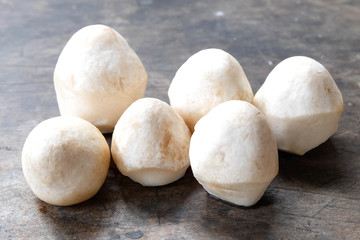 Straw mushroom on wood background 