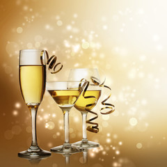 Glasses on Golden Sparkling Background