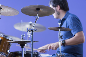 Fototapeta na wymiar male drummer playing drums