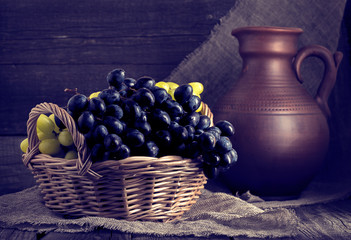 Grapes in a basket in rustic style.