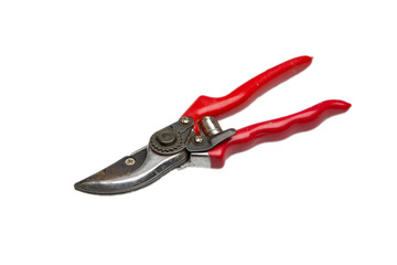 Old red garden secateurs isolated on a white background