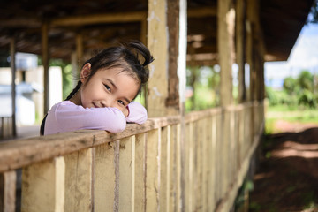Obraz premium Kid playing in the old wood building