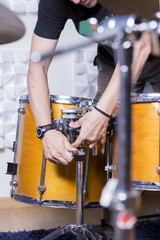 sound technician adjusting the drum.