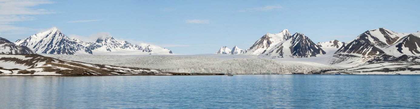 Panorama of glacier above the sea with mountains behind, Svalbar