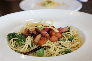 close up of Spaghetti bacon chili with dried tomatoes and basil
