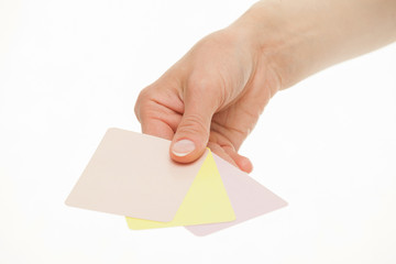 Female hand holding colorful paper cards