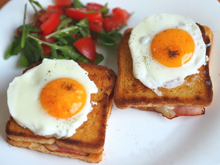 Croque madame (baked or fried boiled ham and cheese sandwich with topped with fried egg).