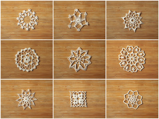 Crocheted snow flakes collage on a wooden background.