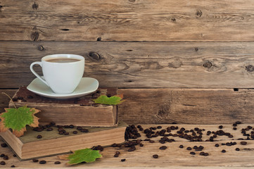 cup of coffee on the old books