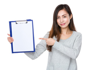 Young woman finger point to blank page of clipboard