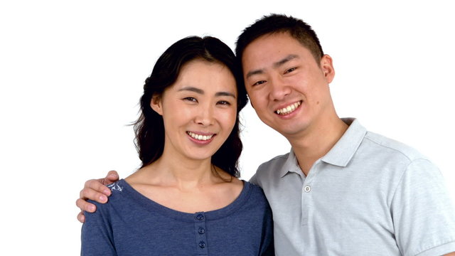 Portrait of Asian smiling couple posing