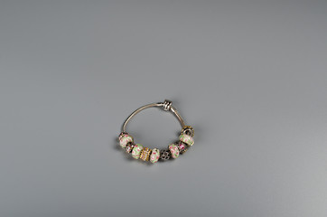 Bracelet with Charms on a gray background