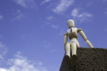 Businessman puppet on the edge