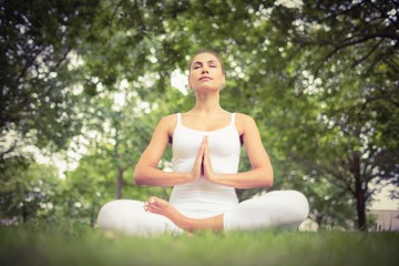 Low angle view of beautiful woman doing yoga