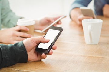 Cropped hands using smartphone 