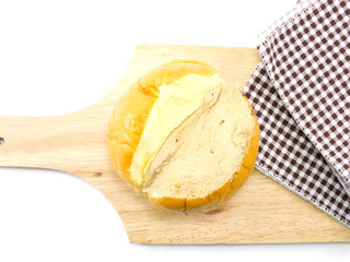 top view of slices bread with butter on a rustic wooden cutting board wooden background