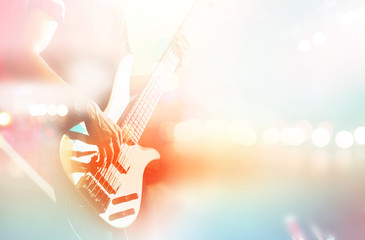 Guitarist bass on stage for background, colorful, pastel color 