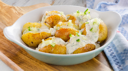 Hot Baked potatoes with chives and cream.