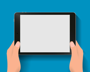 Hands holding tablet computer