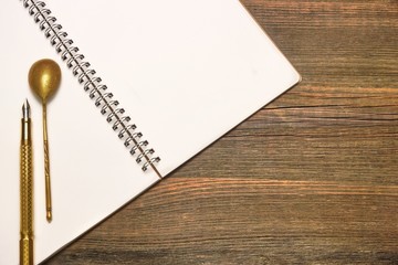 Notebook With Blank Page, Spoon And Pen  On Wood Table