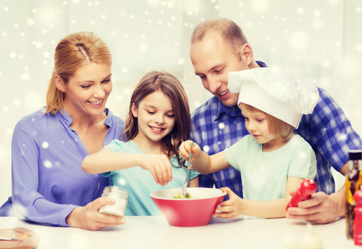 Happy Family With Two Kids Making Salad At Home