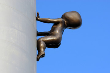Crawling baby on Zizkov tower, Prague