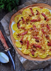 Flammekueche tartiflette, French traditional dish tart Flambe with onion, bacon and potato 