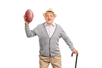 Foto op Canvas Happy senior gentleman holding a football © Ljupco Smokovski