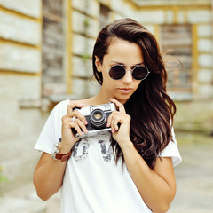 Hipster woman with retro film camera outdoor fashion portrait