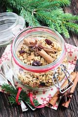 Granola with spices,nuts and dried cranberry. Toned image, selective focus.