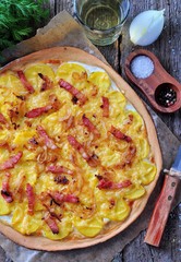 Flammekueche tartiflette, French traditional dish tart Flambe with onion, bacon and potato