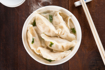 Top view Asian cuisine dumplings soup