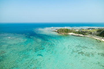 Fototapeta na wymiar Aerial view of tropical coral reef paradise beach lagoon full of beautiful blue and turquoise colour in Amami Oshima, Kagoshima prefecture, next to Okinawa, Tropical Japan